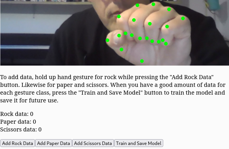 Screenshot aus dem Training des Handgestenmodells. Mit den Buttons unten können für die jeweiligen Gesten Momentaufnahmen der Koordinaten der Markerpunkte gemacht werden. Anschließend wird das Modell im Browser trainiert.